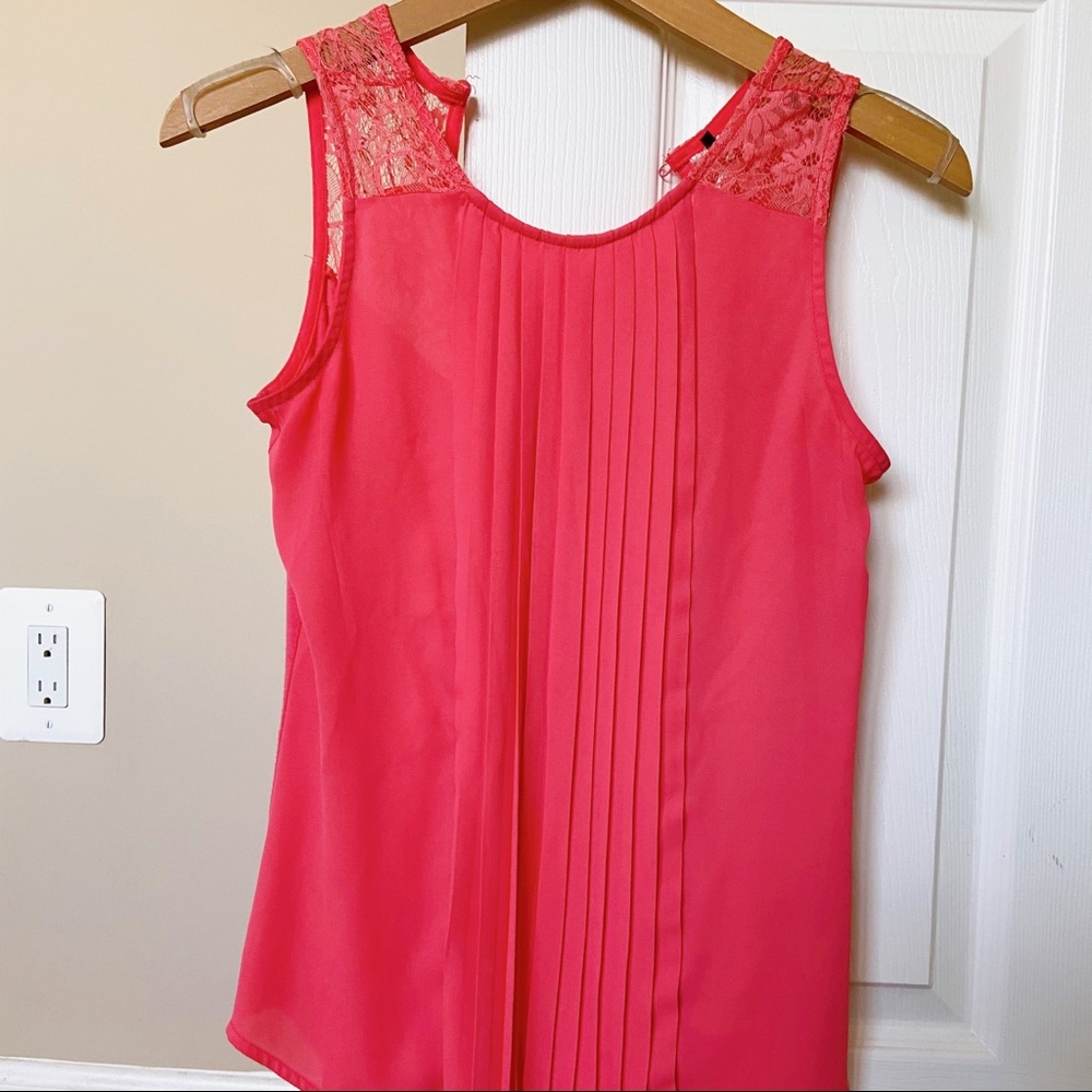 Vibrant pink-orange blouse with detailing